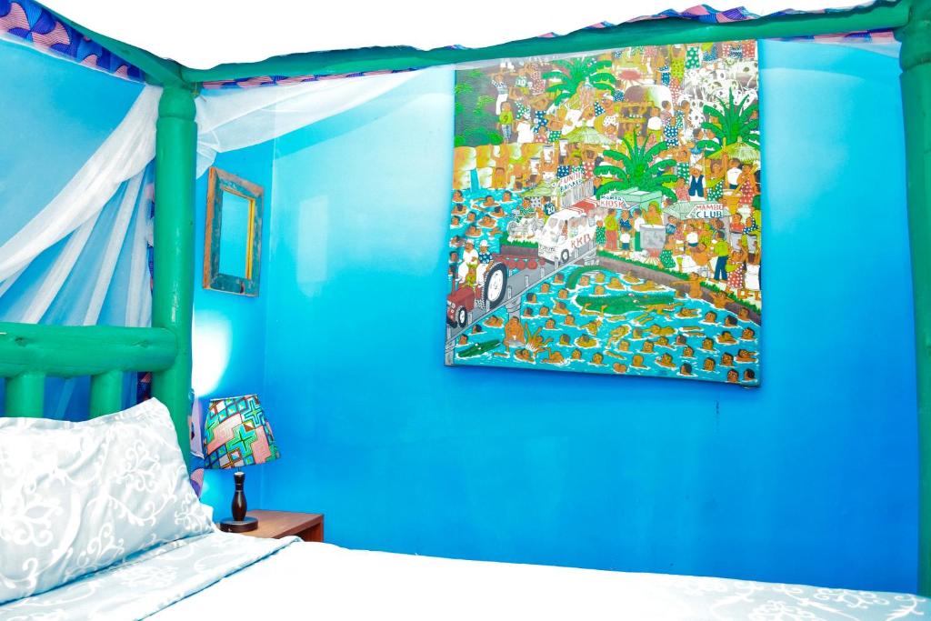 Postel nebo postele na pokoji v ubytování Coccobello Zanzibar