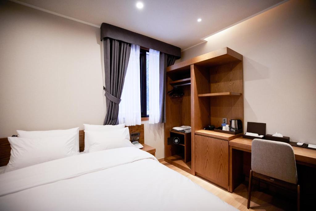 Postel nebo postele na pokoji v ubytování Hotel The Star