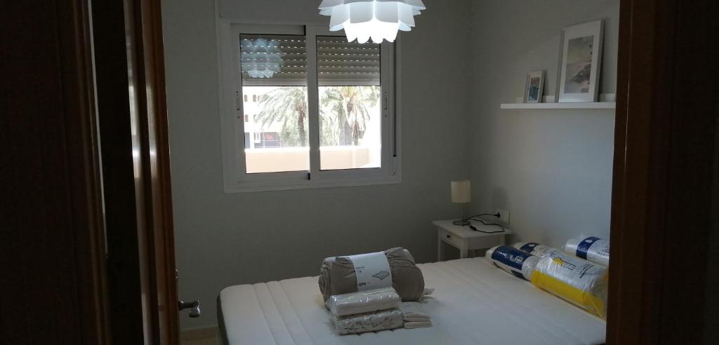 Postel nebo postele na pokoji v ubytování RESIDENCIAL LAS PALMERAS