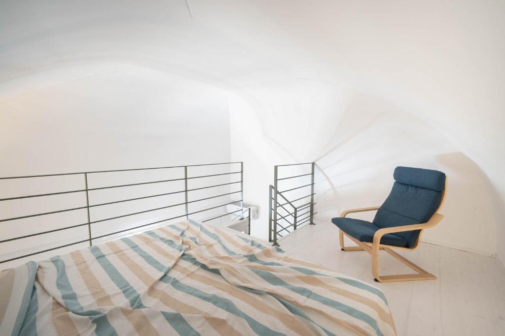 A bed or beds in a room at WePuglia - Dimore Stefania