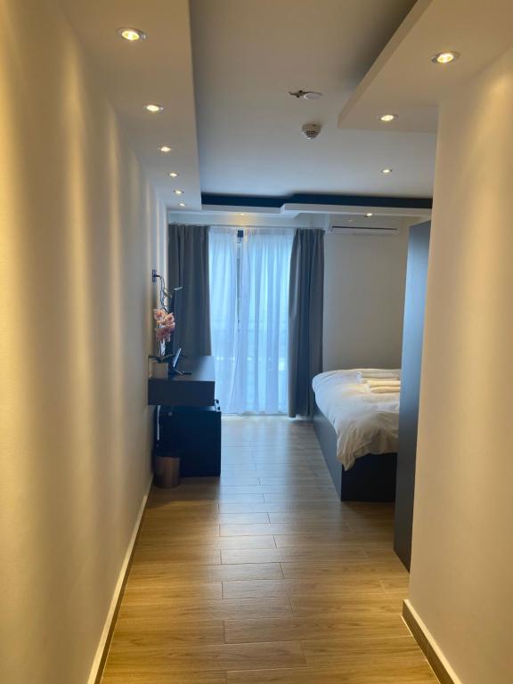 Postel nebo postele na pokoji v ubytování Hôtel Select - Réunion
