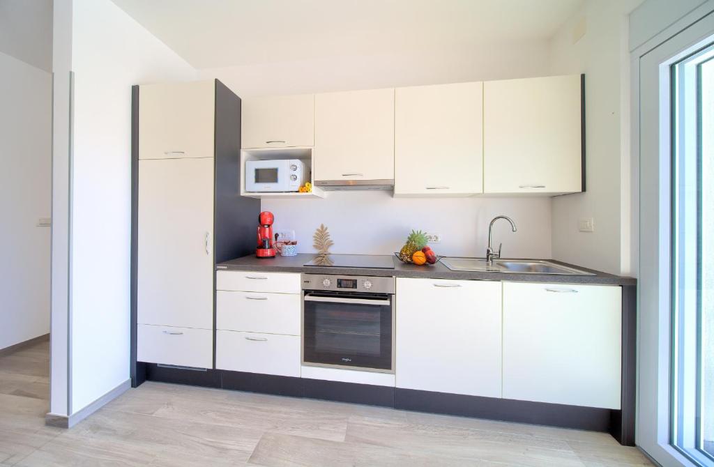 Kuchyň nebo kuchyňský kout v ubytování Apartment Timmy