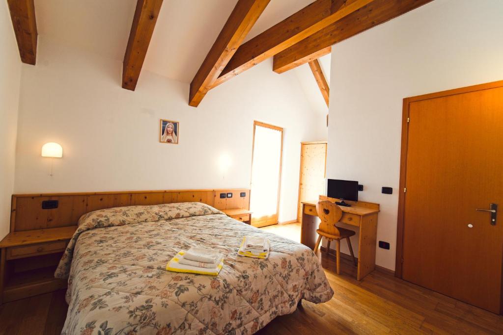 Postel nebo postele na pokoji v ubytování Kapriol