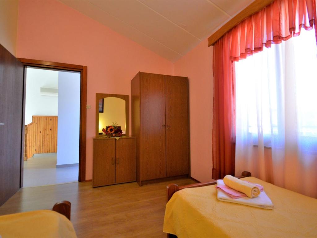 Postel nebo postele na pokoji v ubytování Holiday Home Milka 1 by Interhome