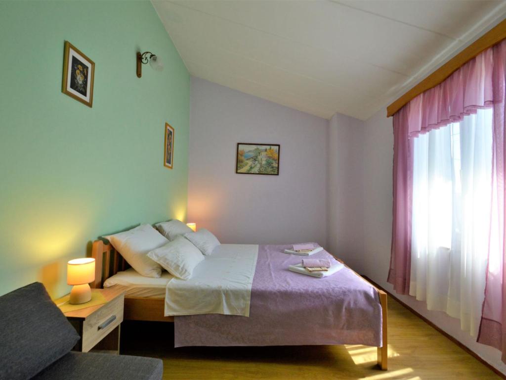 Postel nebo postele na pokoji v ubytování Holiday Home Milka 1 by Interhome