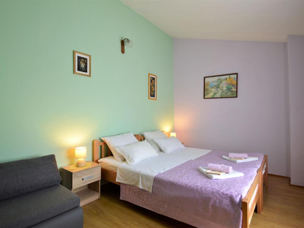 Postel nebo postele na pokoji v ubytování Holiday Home Milka 1 by Interhome