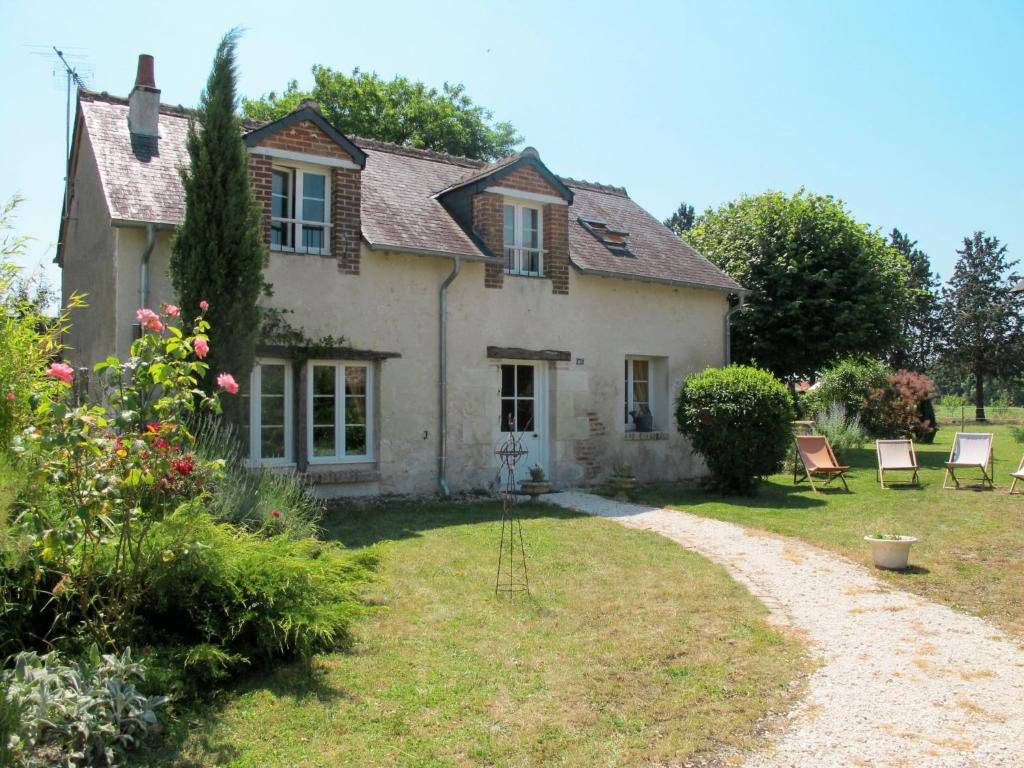 an old house with chairs and a garden at Holiday Home La Janverie - MNX200 by Interhome in Monteaux