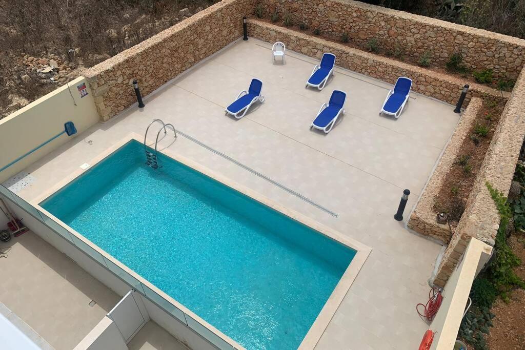 Bazén v ubytování Willeg Retreats 7A 1 Bedroom Luxury Flat Qala Gozo nebo v jeho okolí
