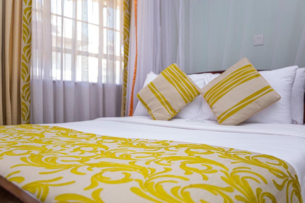 Un pat sau paturi într-o cameră la Desmond Tutu Conference Centre