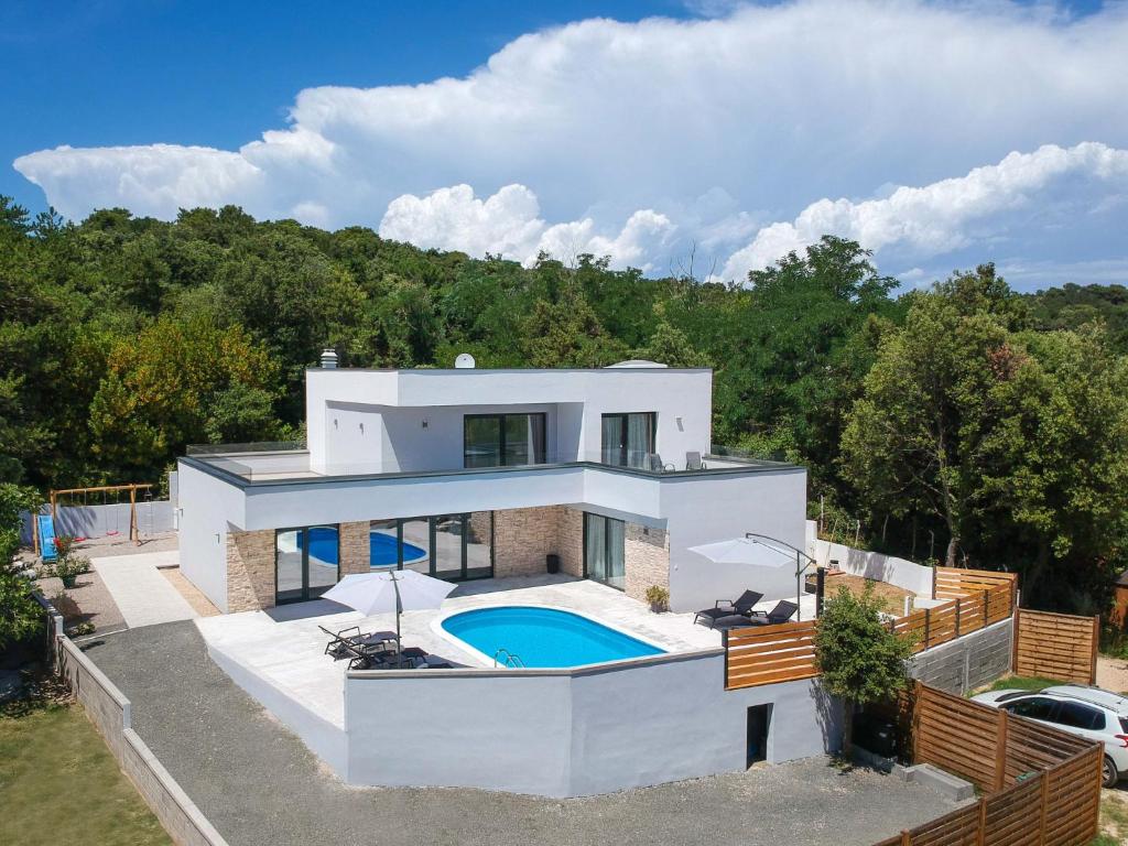 an aerial view of a house with a swimming pool at Villa Pinnidae by Interhome in Lopar