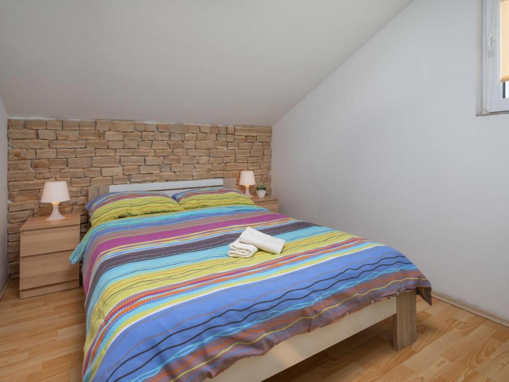 Postel nebo postele na pokoji v ubytování Holiday Home Mikac by Interhome