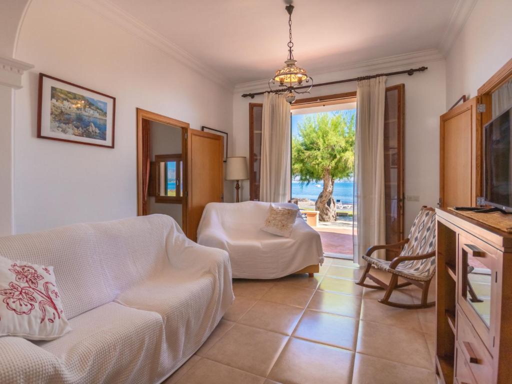 A television and/or entertainment centre at Holiday Home Sa Marina by Interhome