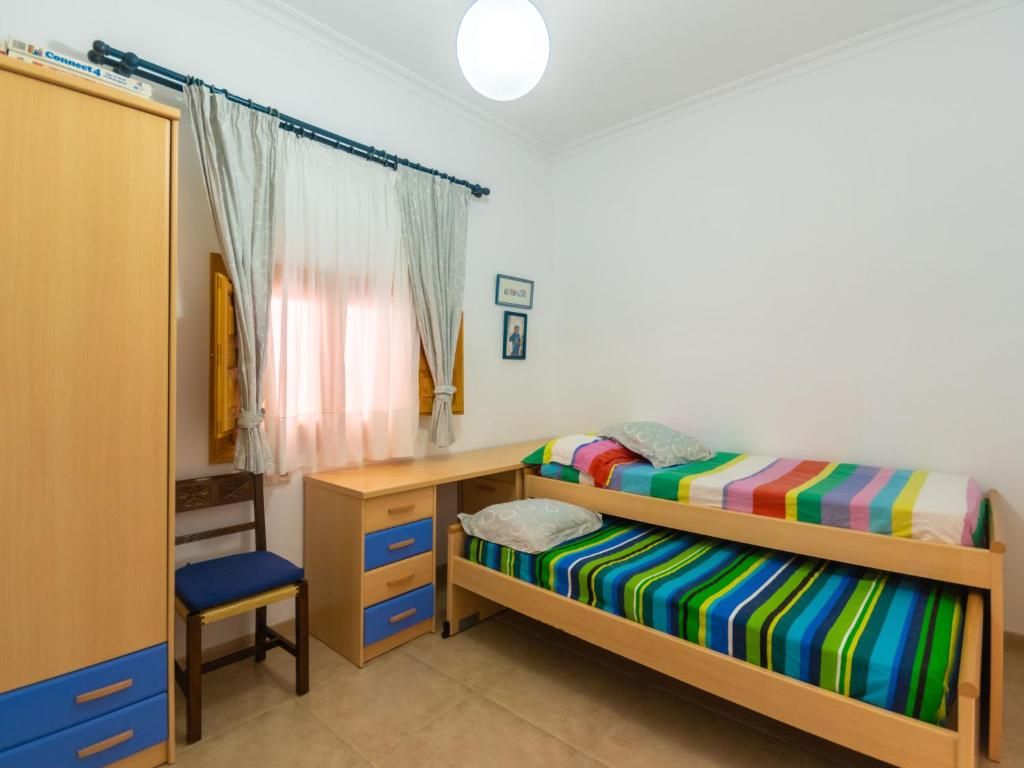 A bed or beds in a room at Holiday Home Sa Marina by Interhome