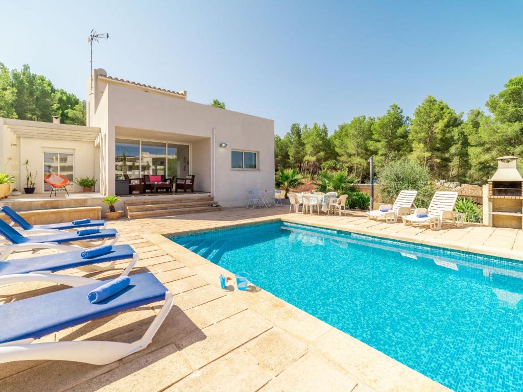 a villa with a swimming pool and a house at Villa Betlem by Interhome in Colonia de Sant Pere