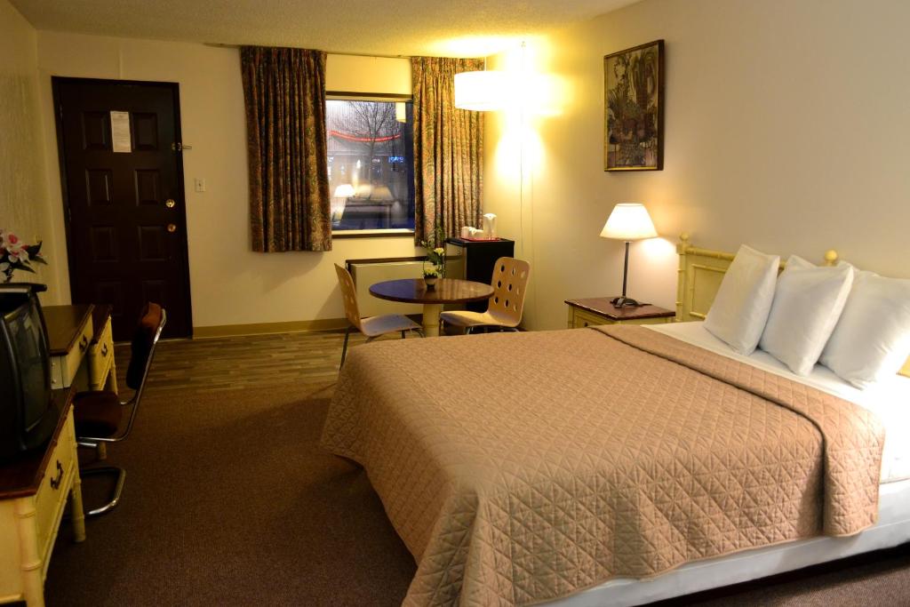 Postel nebo postele na pokoji v ubytování Hoo-Doo Motel