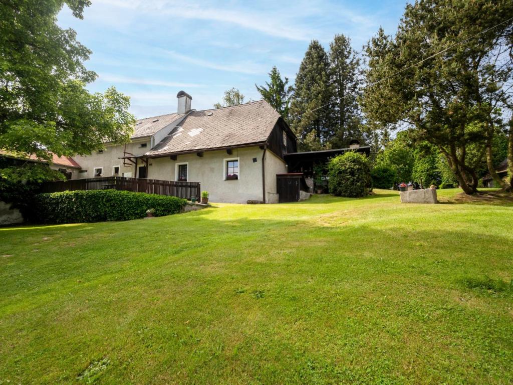 a house with a large lawn in front of it at Holiday Home Újezd Svatého Kříže by Interhome in Bělá nad Radbuzou