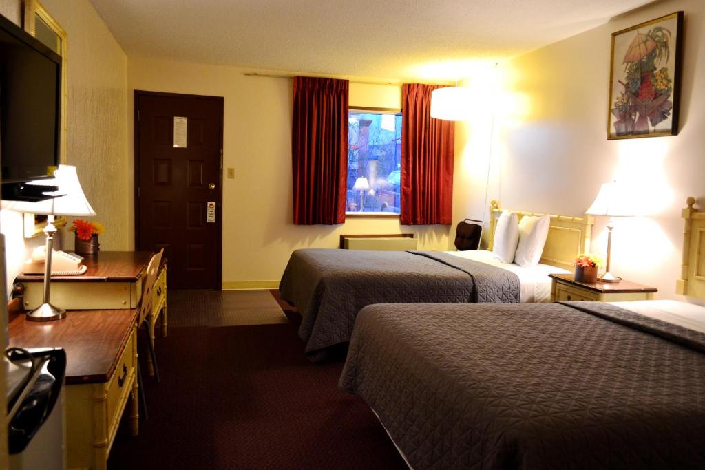 Postel nebo postele na pokoji v ubytování Hoo-Doo Motel