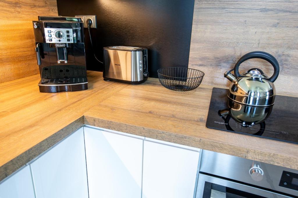Kuchyň nebo kuchyňský kout v ubytování Apartmány DOME