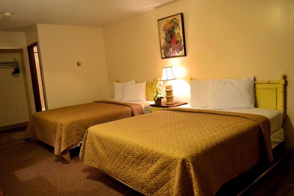 Postel nebo postele na pokoji v ubytování Hoo-Doo Motel