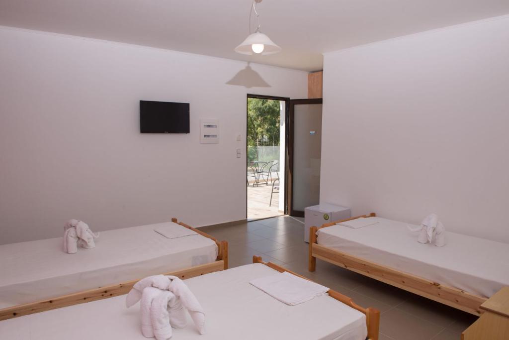 Postel nebo postele na pokoji v ubytování Paradise Matala Hotel