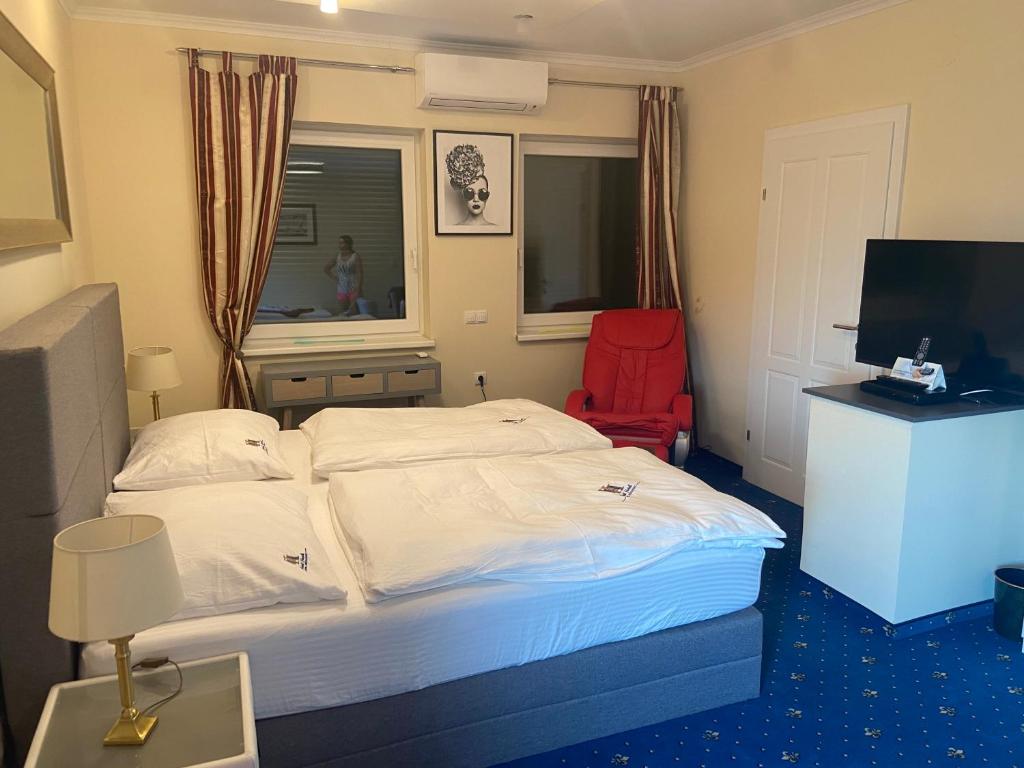 Postel nebo postele na pokoji v ubytování Hotel Restaurant Hesch