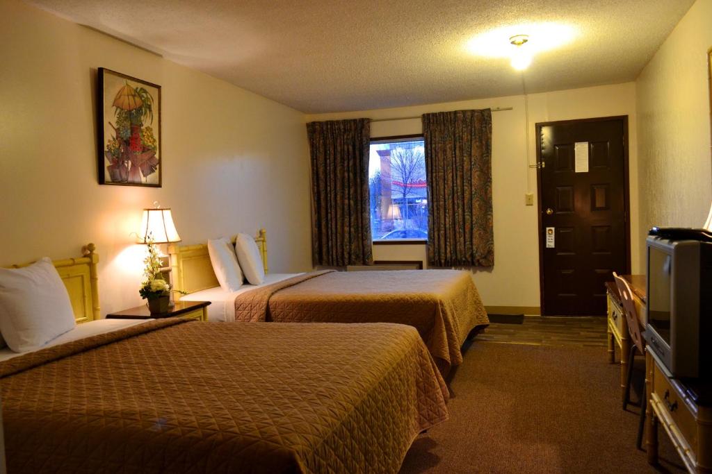Postel nebo postele na pokoji v ubytování Hoo-Doo Motel