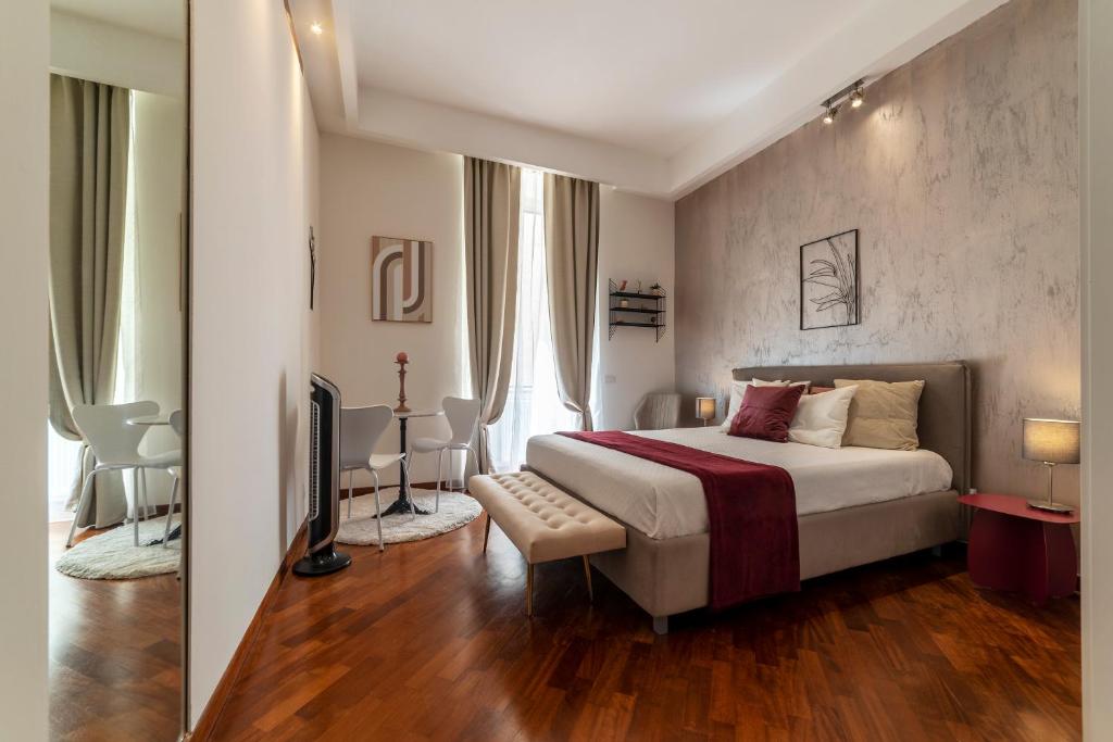 a bedroom with a bed and a television in it at Castel Sant'Angelo Design Apartment in Rome