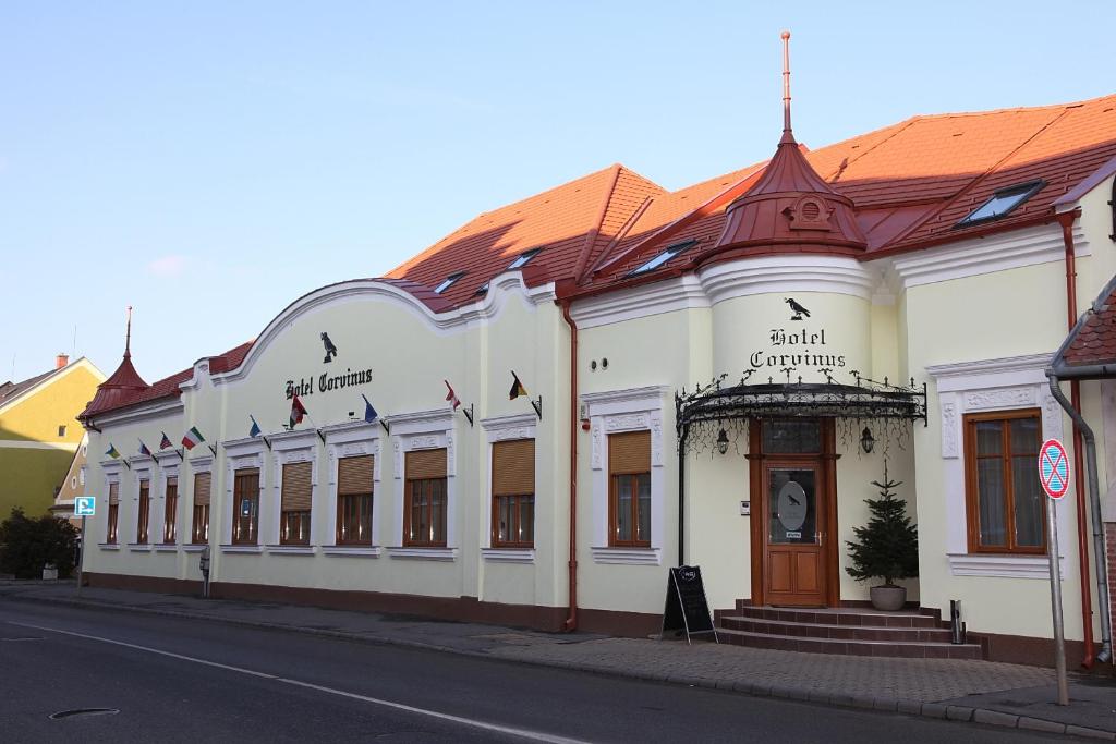 a building on the side of a street at Hotel Corvinus in Zalaszentgrót