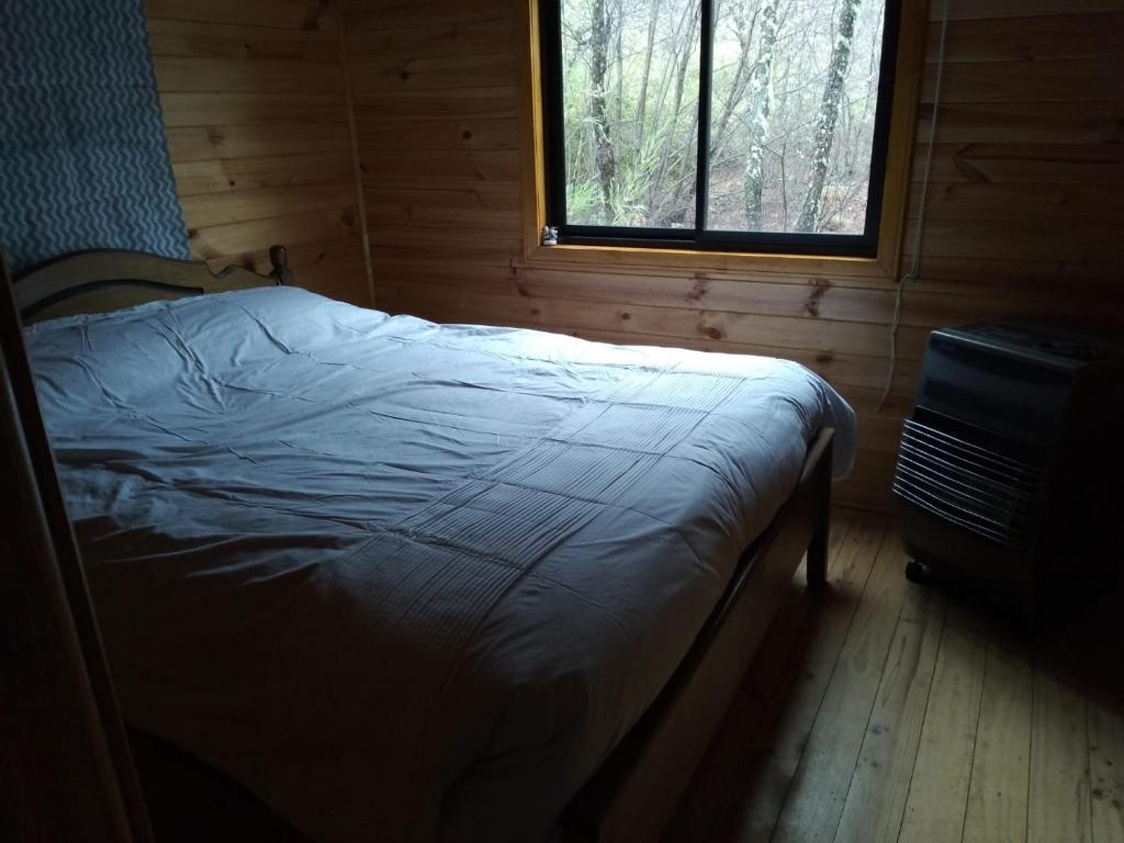 Postel nebo postele na pokoji v ubytování Refugio Altazor