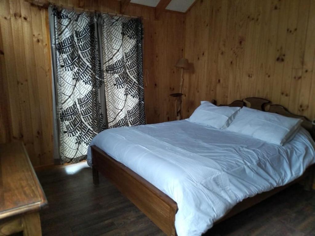 Postel nebo postele na pokoji v ubytování Refugio Altazor