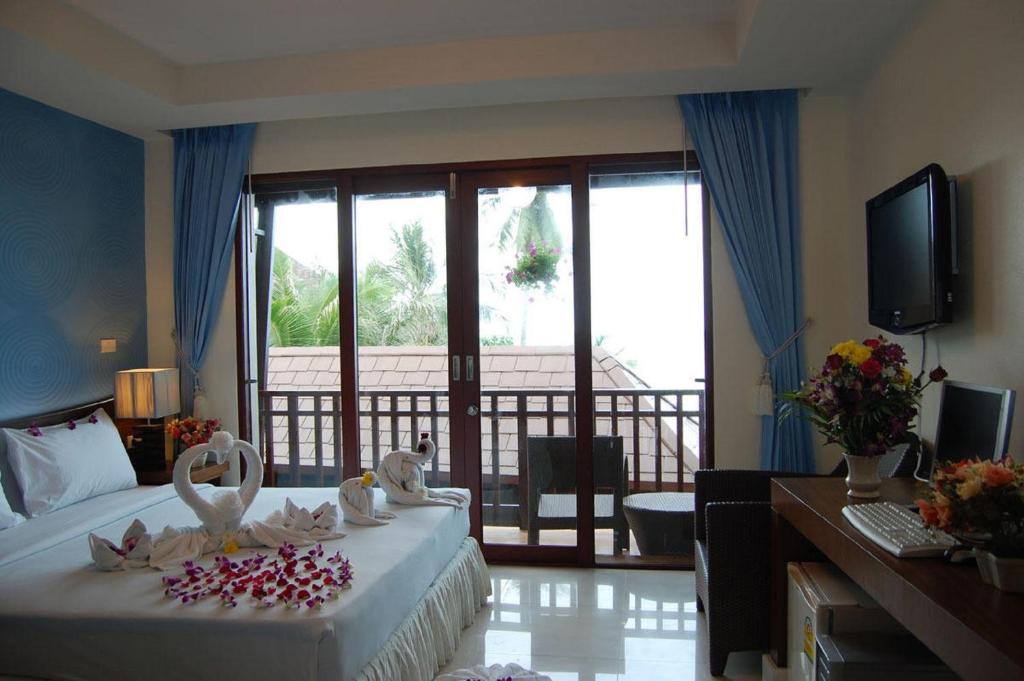 Кровать или кровати в номере Mac Resort Hotel