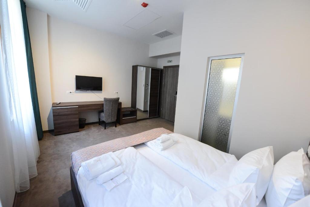 Postel nebo postele na pokoji v ubytování Hotel Cara 28
