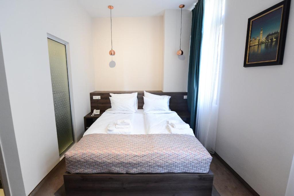 Postel nebo postele na pokoji v ubytování Hotel Cara 28