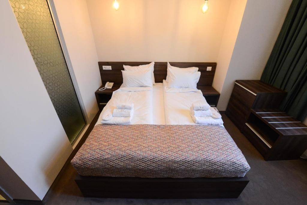 Postel nebo postele na pokoji v ubytování Hotel Cara 28