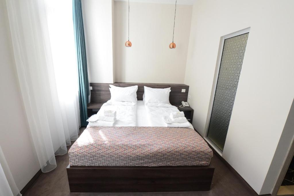 Postel nebo postele na pokoji v ubytování Hotel Cara 28