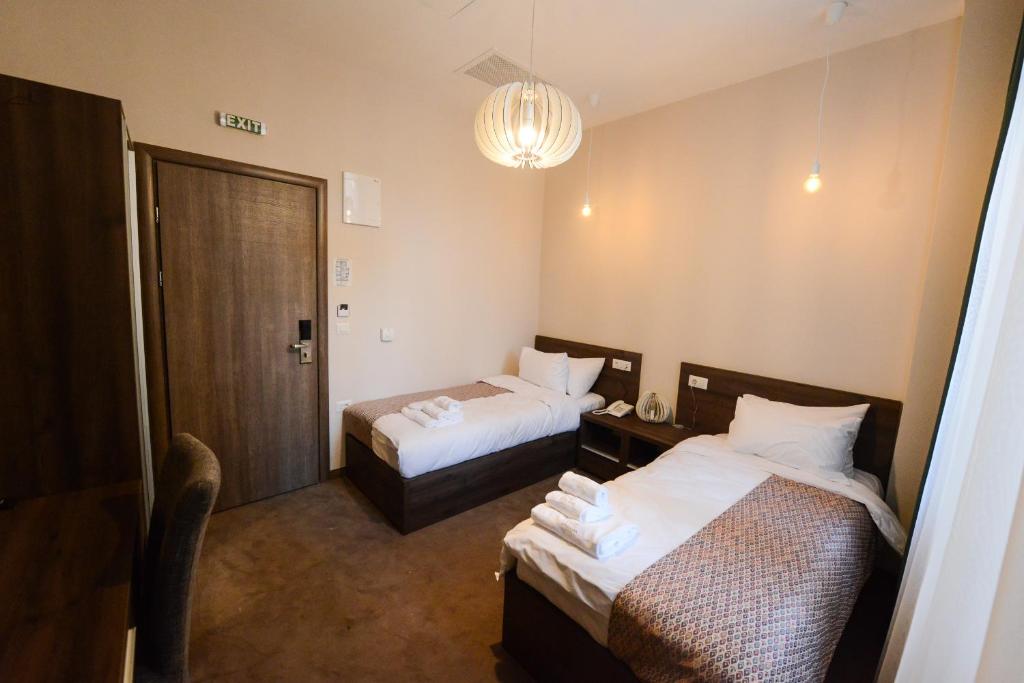 Postel nebo postele na pokoji v ubytování Hotel Cara 28