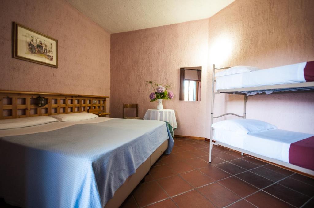 Postel nebo postele na pokoji v ubytování Hotel Scintilla