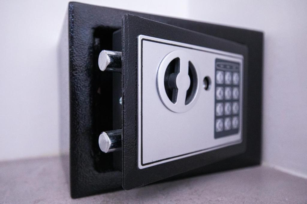 a black and white electrical outlet on a wall at Donnosanto Residence Pantanagianni in Torre Santa Sabina