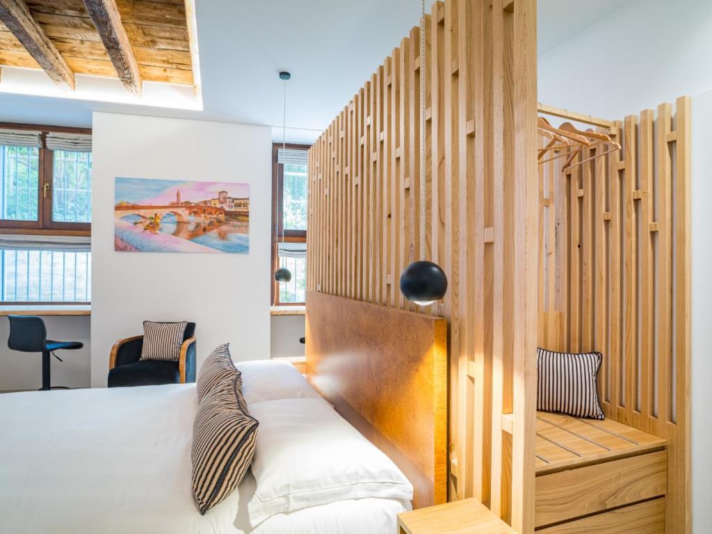 Postel nebo postele na pokoji v ubytování Design Rooms Verona