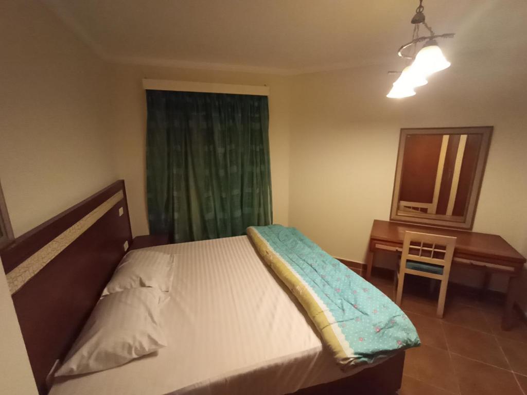 Postel nebo postele na pokoji v ubytování Oasis marsa alam