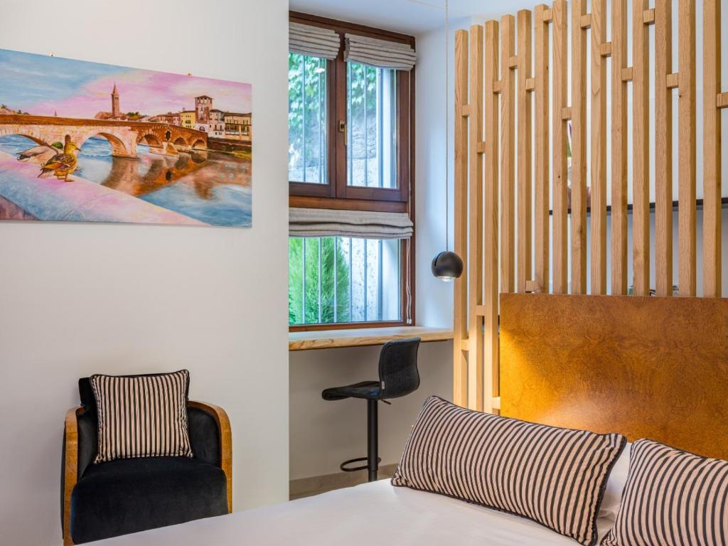 Postel nebo postele na pokoji v ubytování Design Rooms Verona