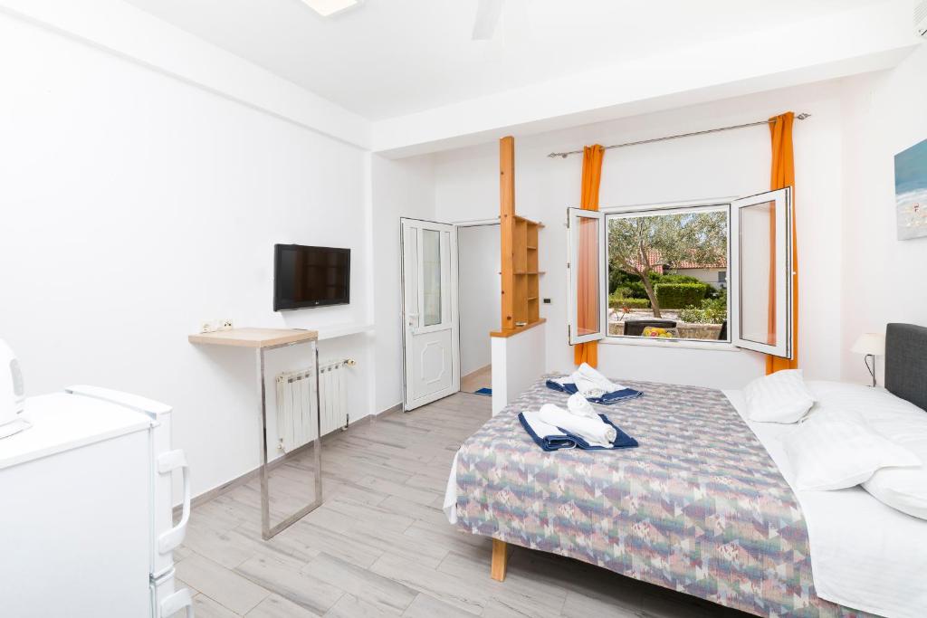 Postel nebo postele na pokoji v ubytování Stella Mare Eco Boutique House