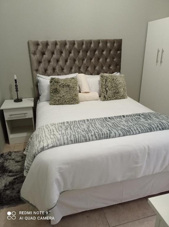 Ένα ή περισσότερα κρεβάτια σε δωμάτιο στο Atholl Heights Home - BnB 2