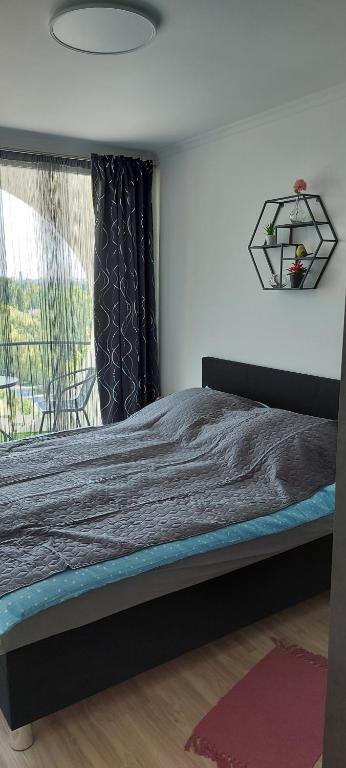 Posteľ alebo postele v izbe v ubytovaní Life Apartmanok
