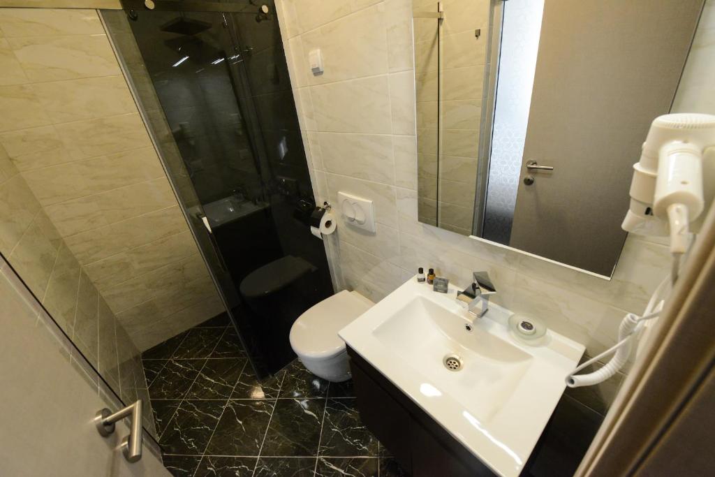 Koupelna v ubytování Hotel Cara 28
