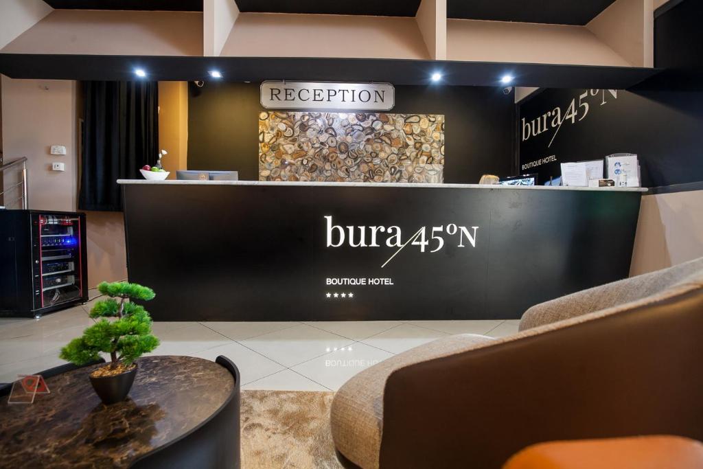 a store with a black and white display with a table at Boutique Hotel Bura 45N in Senj