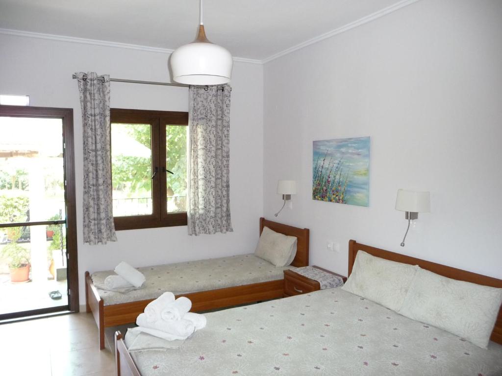 Postel nebo postele na pokoji v ubytování House Evristhenis 2