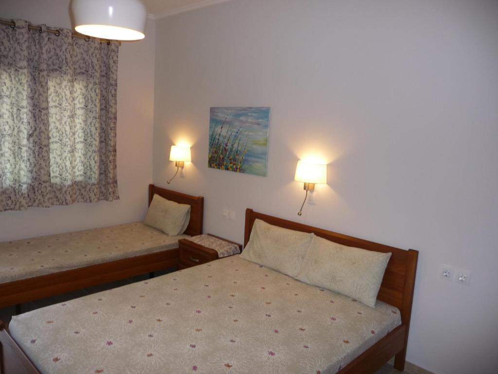 Postel nebo postele na pokoji v ubytování House Evristhenis 2