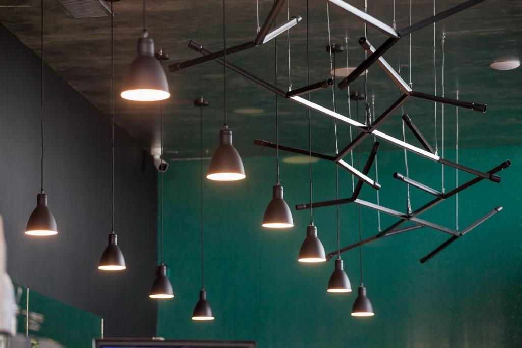 a chandelier with many lights hanging from a ceiling at Boutique Hotel Bura 45N in Senj