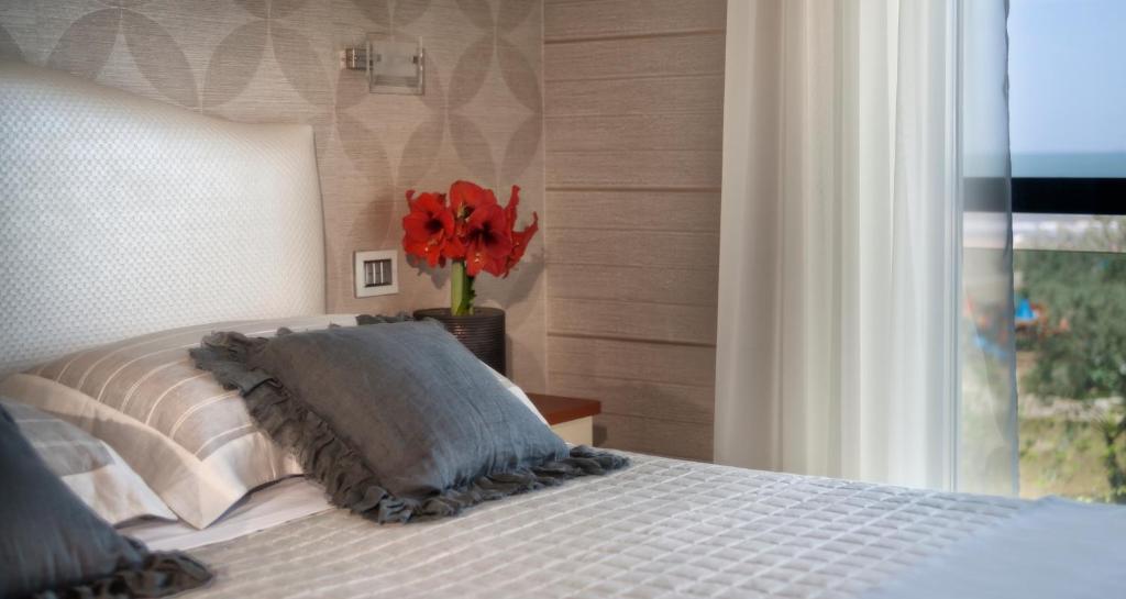 Postel nebo postele na pokoji v ubytování Hotel Vistamare